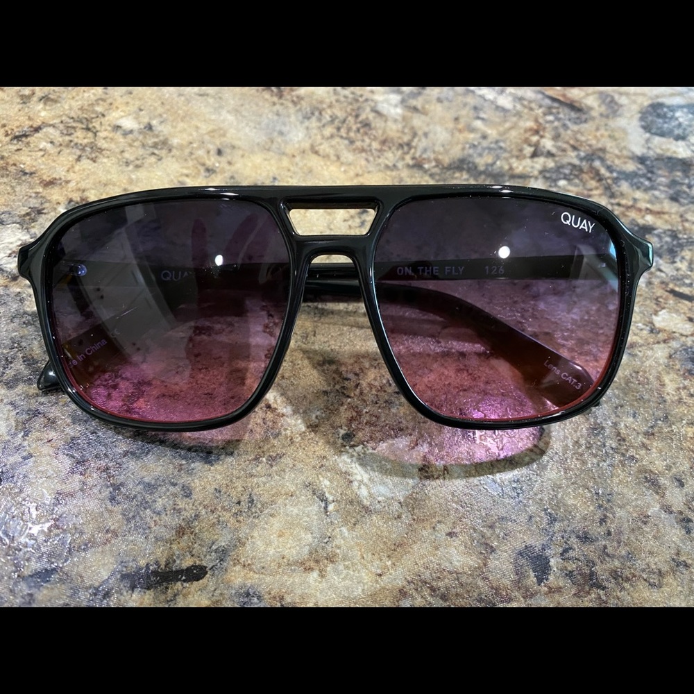 Brand new Quay sunglasses. Never worn. Comes with glasses holder. “On the Fly”